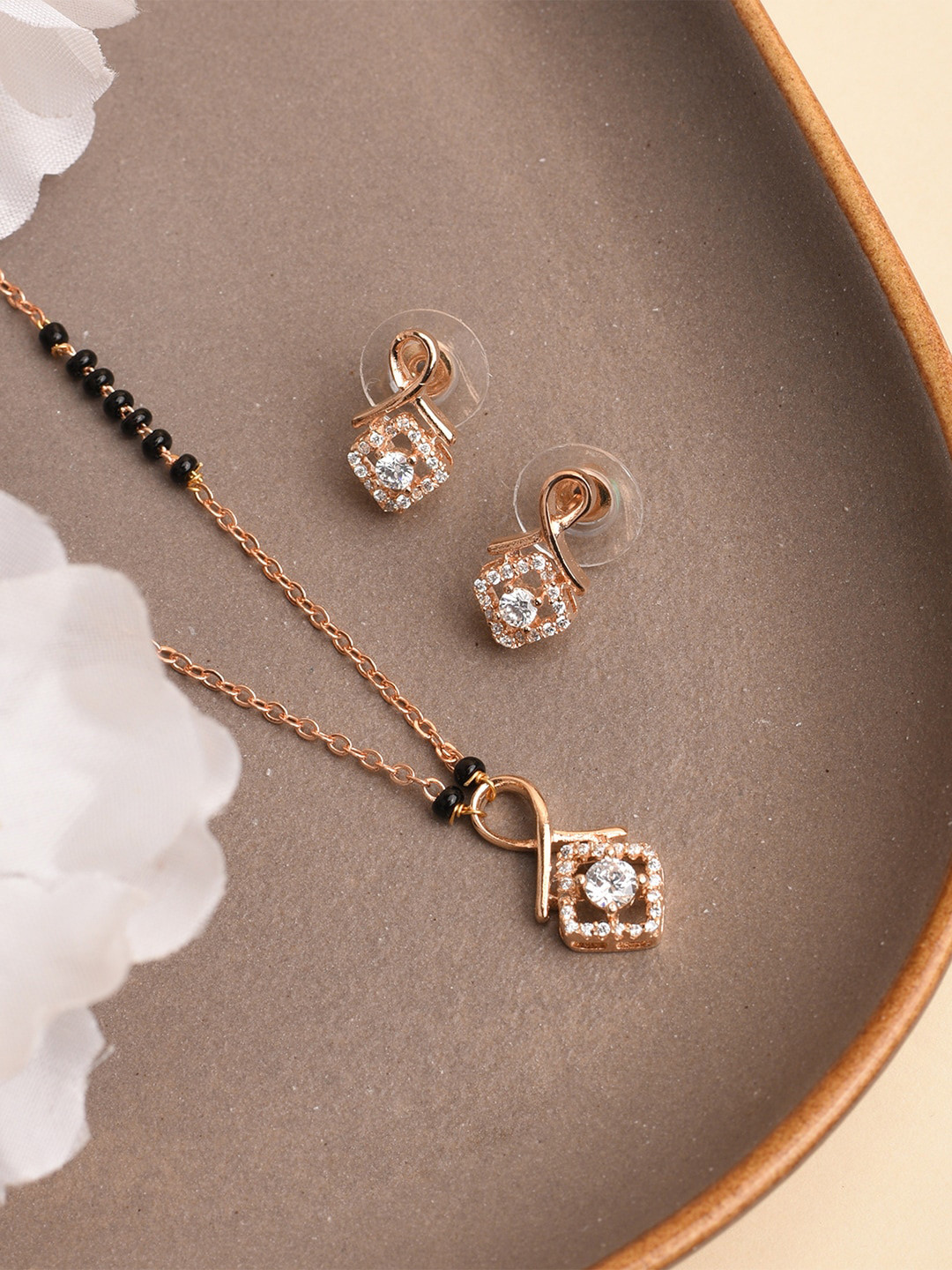 XPNSV Gold-Plated AD Stone Studded & Beaded Mangalsutra With Earrings
XPNSV Gold-Plated AD Stone Studded & Beaded Mangalsutra With Earrings