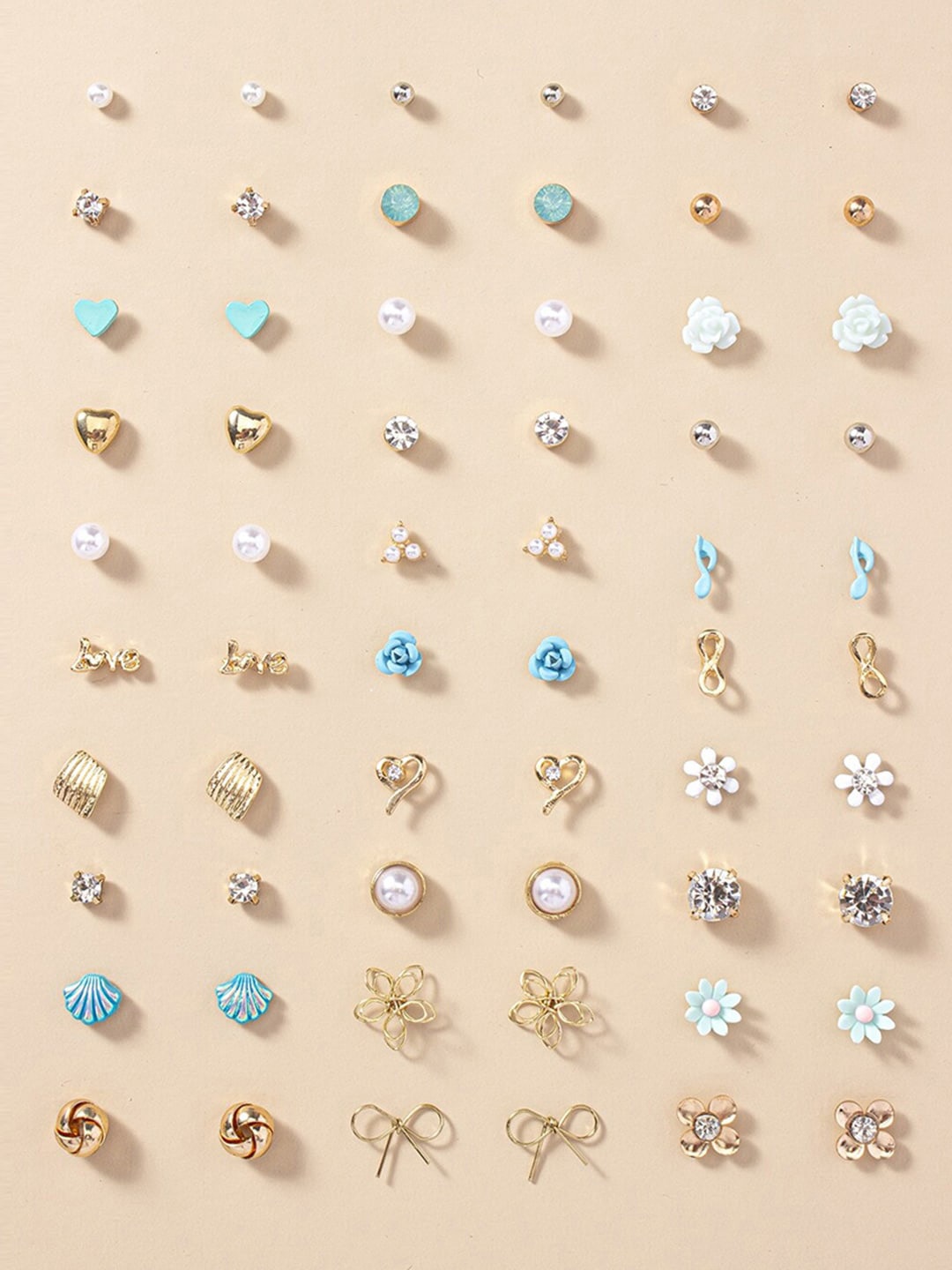 Jewels Galaxy Set Of 30 Gold Plated Crystals & Pearl Beaded Contemporary Stud Earrings
Jewels Galaxy Set Of 30 Gold Plated Crystals & Pearl Beaded Contemporary Stud Earrings