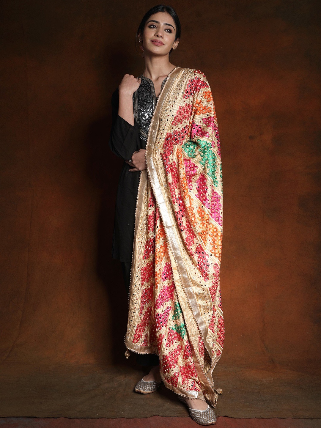 Exotic India Beige Phulkari Mirror Embroidered Silk Dupatta and Gotapatti Border
Exotic India Beige Phulkari Mirror Embroidered Silk Dupatta and Gotapatti Border