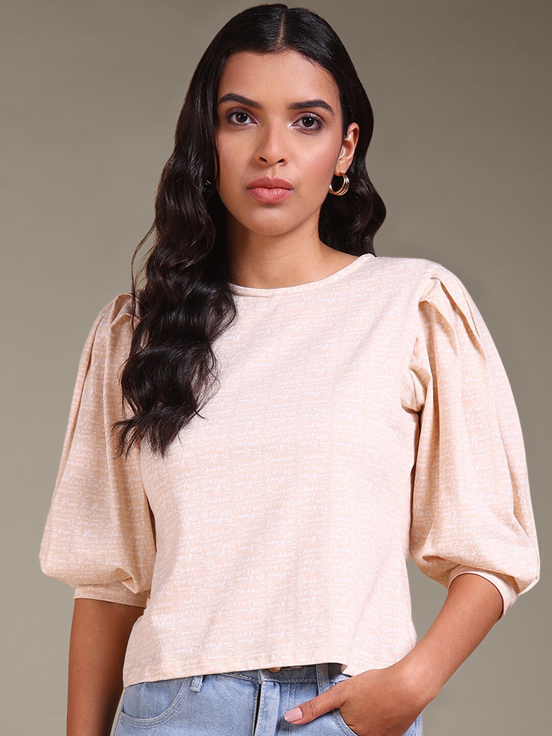 The Roadster Lifestyle Co. Beige &white Typography Printed Puff Sleeves Cotton Regular Top
The Roadster Lifestyle Co. Beige &white Typography Printed Puff Sleeves Cotton Regular Top