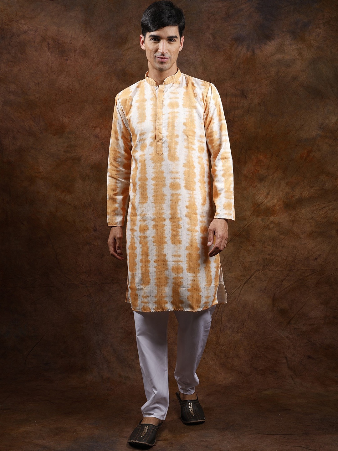 Exotic India Tie Dye Printed Kurta Pajama Set with Sequins and Straight Stitch Embroidery, Orange
Exotic India Tie Dye Printed Kurta Pajama Set with Sequins and Straight Stitch Embroidery, Orange