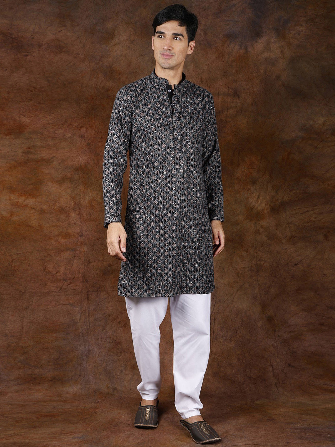 Exotic India Black With Green Intricate Heavy Embroidered Wedding Kurta Pajama and Sequins
Exotic India Black With Green Intricate Heavy Embroidered Wedding Kurta Pajama and Sequins