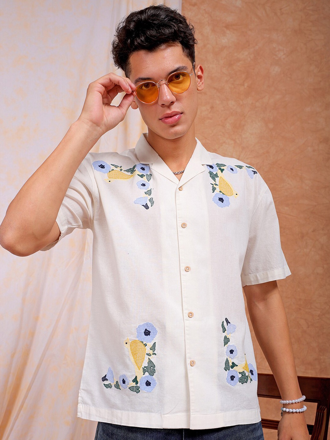 The Indian Garage Co Off White Relaxed Fit Floral Embroidered Cuban Collar Cotton Shirt
The Indian Garage Co Off White Relaxed Fit Floral Embroidered Cuban Collar Cotton Shirt
