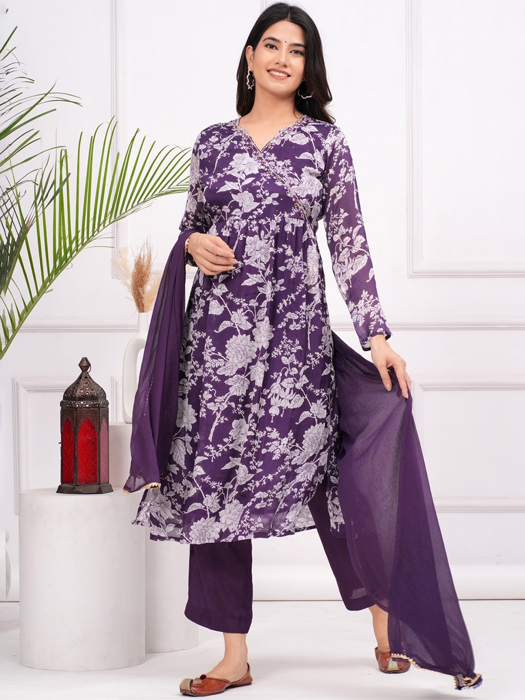 KALINI Floral Printed V-Neck Beads and Stones Straight Kurta with Trousers & Dupatta, Purple
KALINI Floral Printed V-Neck Beads and Stones Straight Kurta with Trousers & Dupatta, Purple