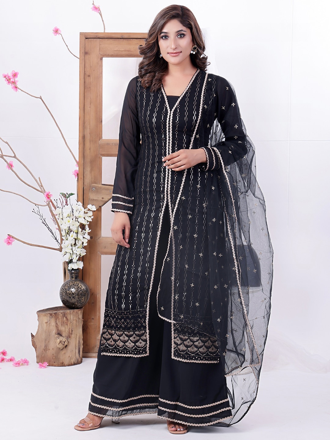 Ethnovog Striped Embroidered Sequinned V-Neck Kurta with Palazzos & With Dupatta, Black
Ethnovog Striped Embroidered Sequinned V-Neck Kurta with Palazzos & With Dupatta, Black