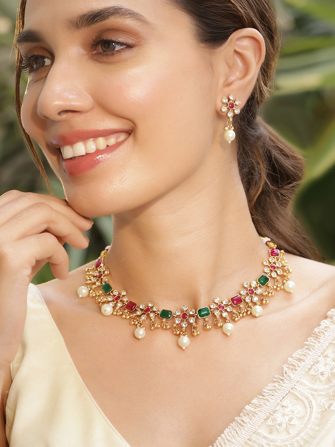 Rubans 22KT Gold Plated Brass Red And Green Stone Studded Pearls Hanging Jewellery Set
Rubans 22KT Gold Plated Brass Red And Green Stone Studded Pearls Hanging Jewellery Set