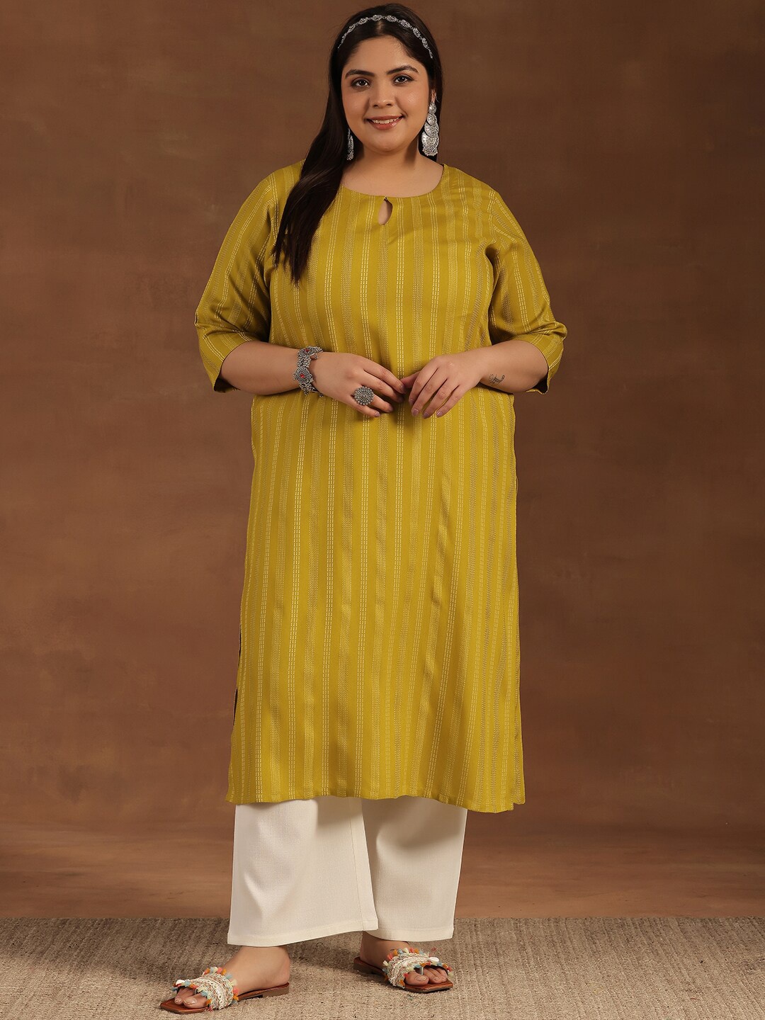 EXTRA LOVE BY LIBAS Plus Size Striped Keyhole Neck Thread Work Straight Kurta, Mustard
EXTRA LOVE BY LIBAS Plus Size Striped Keyhole Neck Thread Work Straight Kurta, Mustard