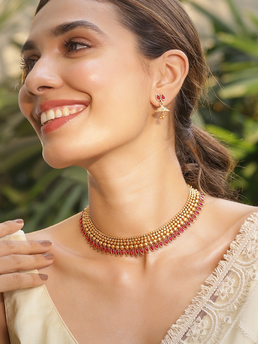 Rubans 22K Gold-Plated Handcrafted Brass Necklace Set with Ruby Red Stones & Pearl Drops
Rubans 22K Gold-Plated Handcrafted Brass Necklace Set with Ruby Red Stones & Pearl Drops