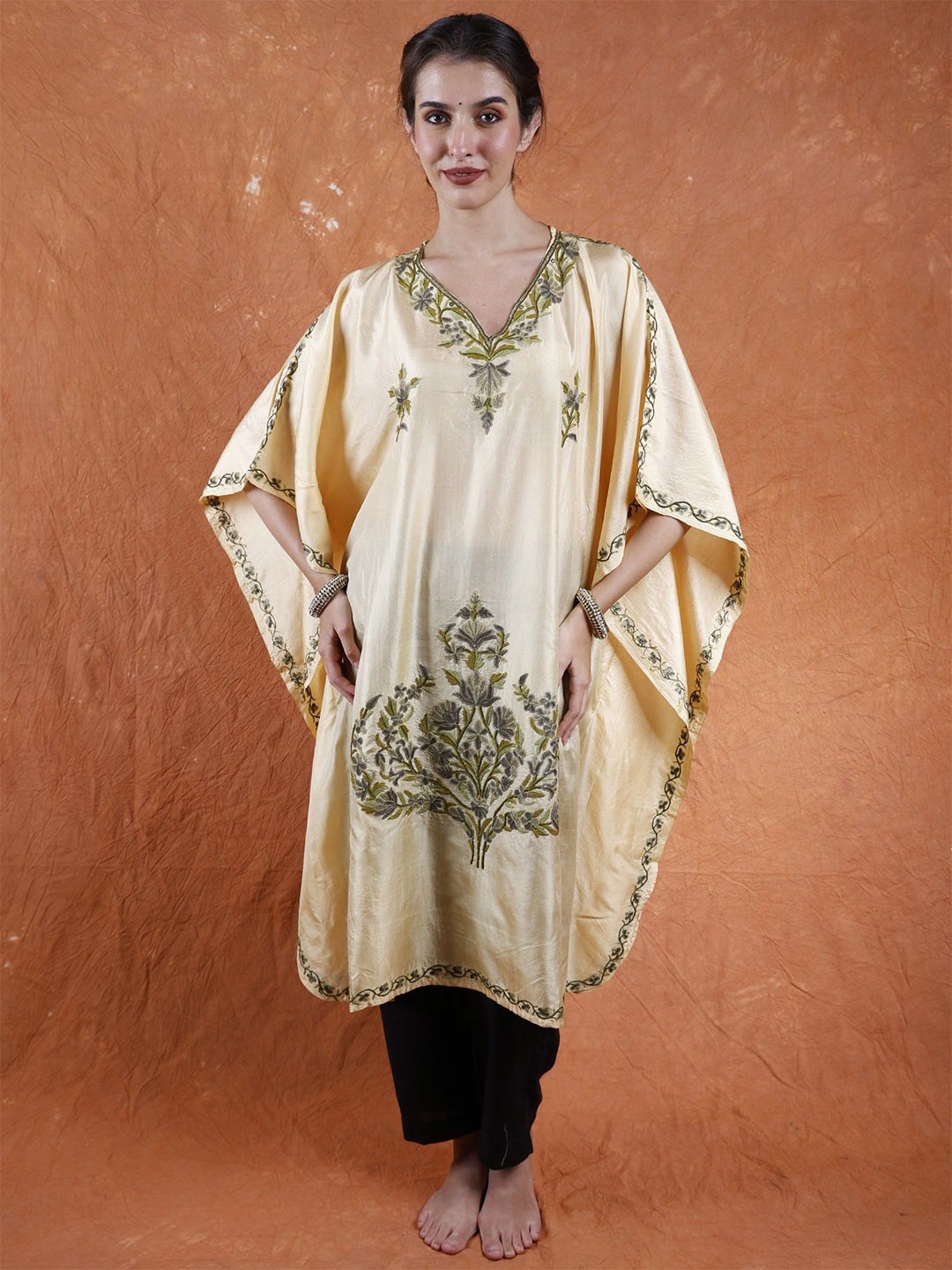 Exotic India Summer Melon Pure Silk Short Kashmiri Kaftan with Floral Aari Hand Embroidery, Beige
Exotic India Summer Melon Pure Silk Short Kashmiri Kaftan with Floral Aari Hand Embroidery, Beige