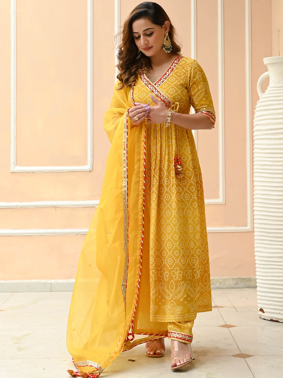 Bunaai Women Bandhani Printed Angrakha Gotta Patti Kurta with Trousers & With Dupatta, Yellow
Bunaai Women Bandhani Printed Angrakha Gotta Patti Kurta with Trousers & With Dupatta, Yellow