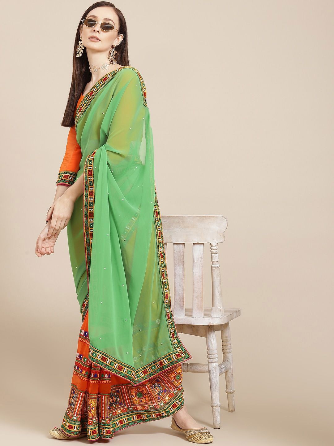 RAJGRANTH Ethnic Motifs Kutchi Embroidery Pure Georgette Half and Half Saree, Orange
RAJGRANTH Ethnic Motifs Kutchi Embroidery Pure Georgette Half and Half Saree, Orange