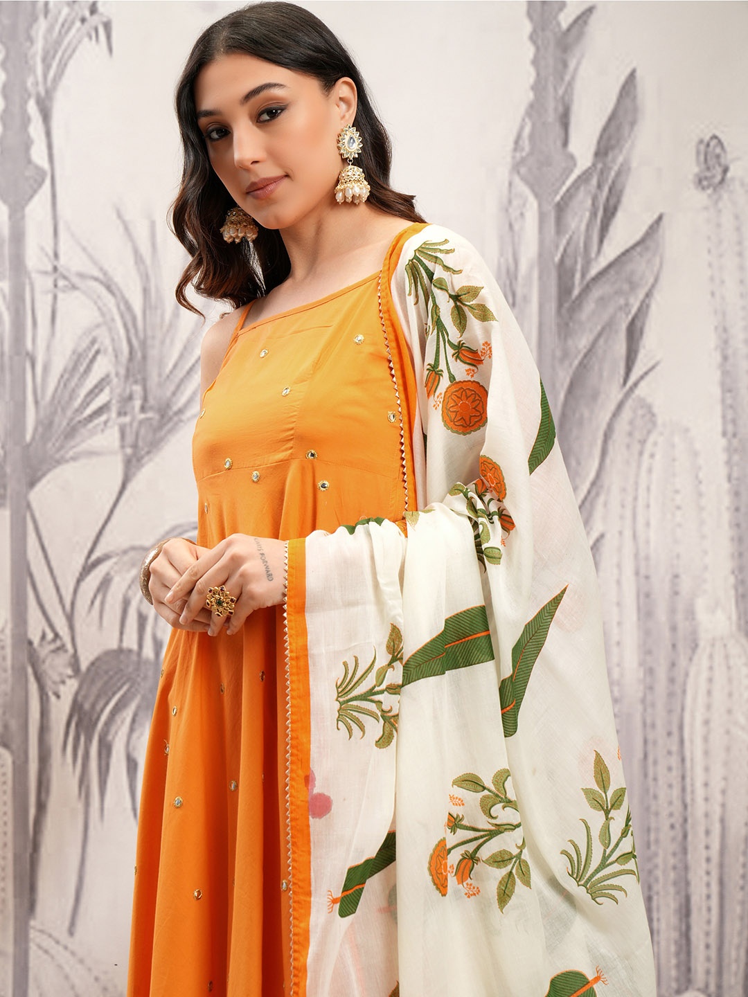Vishudh Orange & Cream Embroidered Mirror Work Pure Cotton Kurta with Trousers & Dupatta
Vishudh Orange & Cream Embroidered Mirror Work Pure Cotton Kurta with Trousers & Dupatta