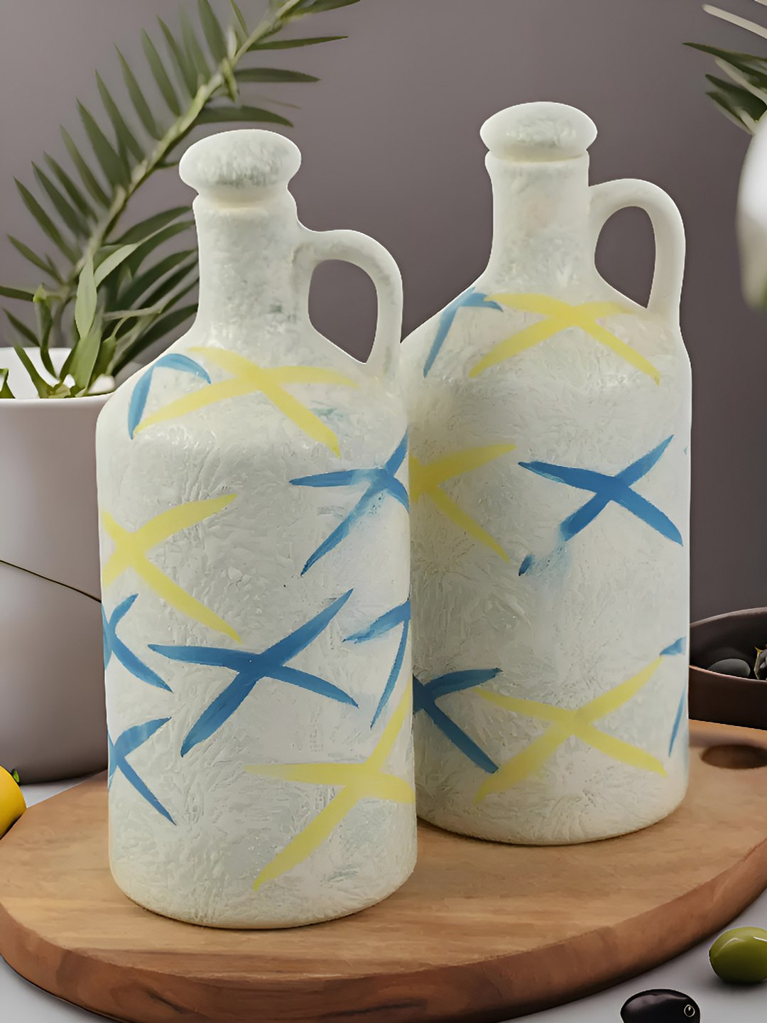Kaolinite Off White & Yellow 2 Pieces Printed Ceramic Oil Dispenser Bottles 750 ml Each
Kaolinite Off White & Yellow 2 Pieces Printed Ceramic Oil Dispenser Bottles 750 ml Each