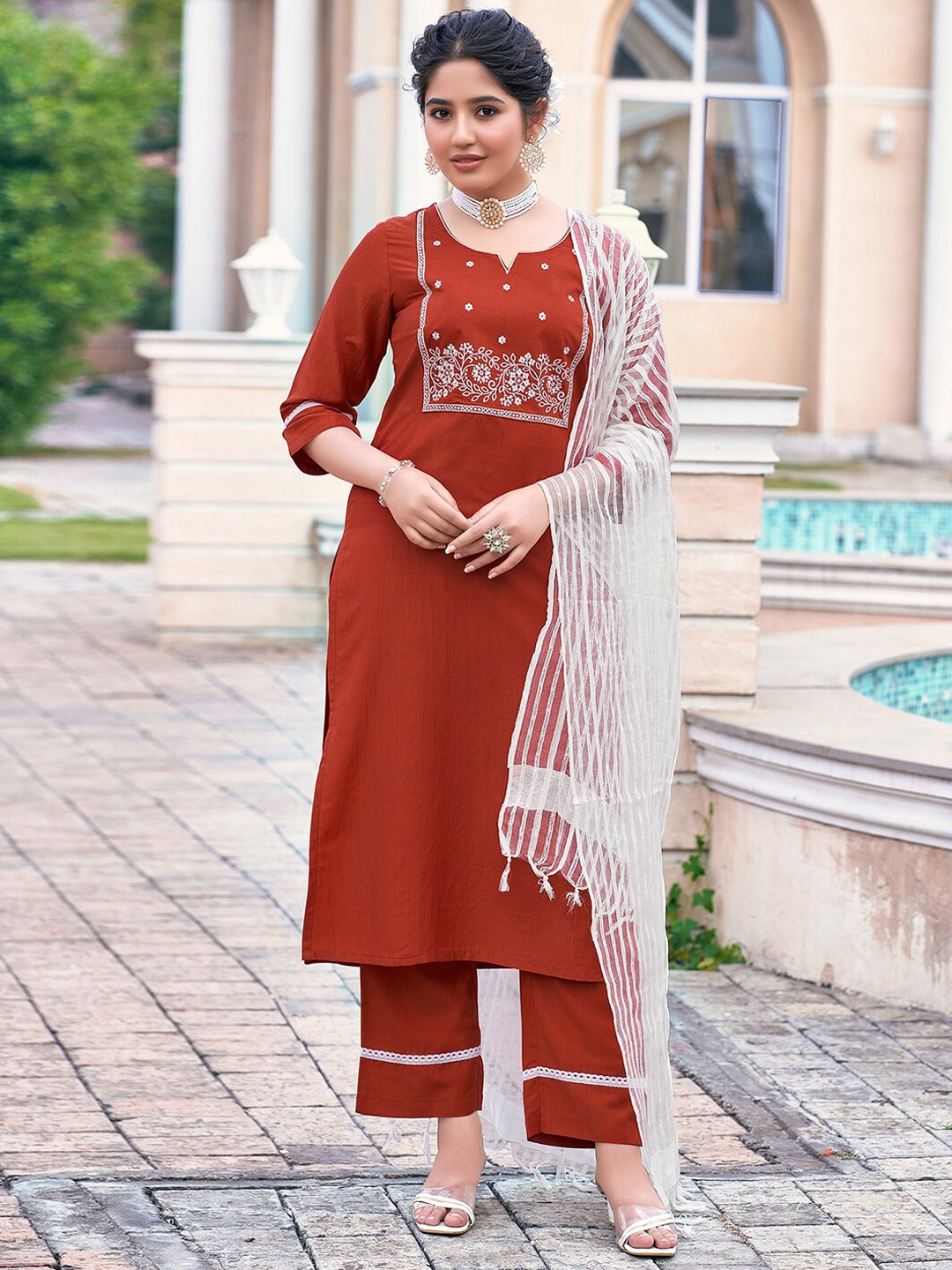 KALINI Floral Yoke Designed Straight Thread Work Kurta with Trousers & Dupatta, Rust
KALINI Floral Yoke Designed Straight Thread Work Kurta with Trousers & Dupatta, Rust