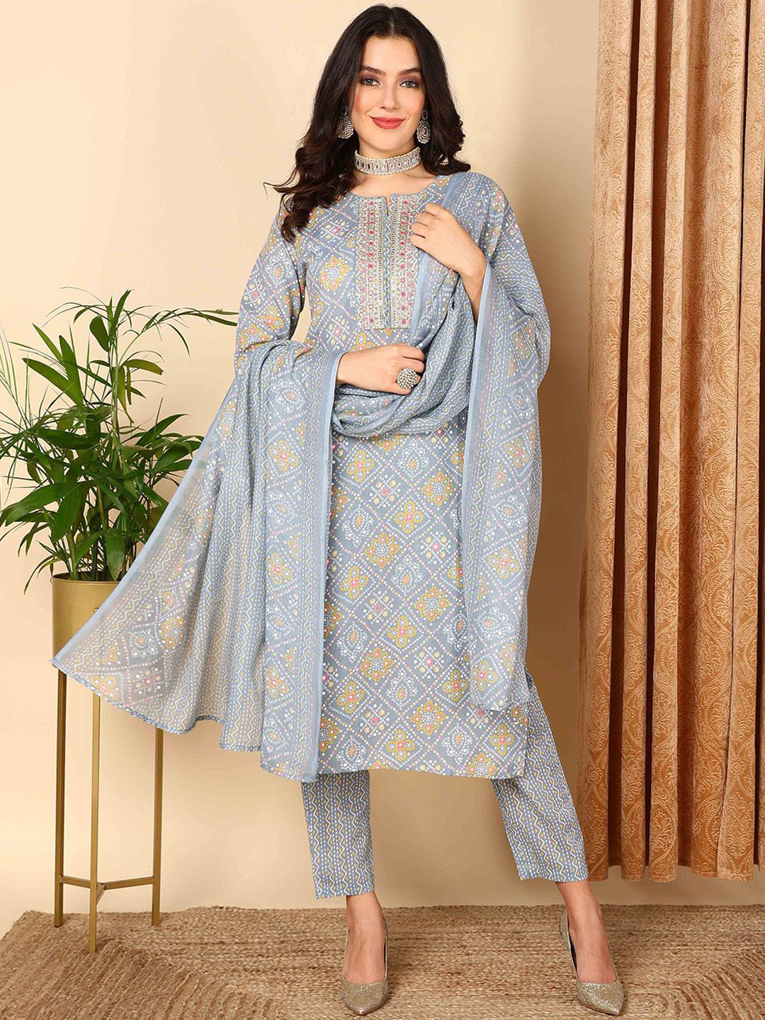 KALINI Bandhani Printed Straight Thread Work Kurta with Trousers & Dupatta, Grey
KALINI Bandhani Printed Straight Thread Work Kurta with Trousers & Dupatta, Grey