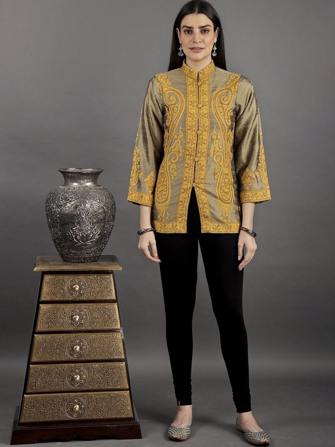 Exotic India Tree House Short Mandarin Jacket with Contrast Giant Paisley Embroidery, Green
Exotic India Tree House Short Mandarin Jacket with Contrast Giant Paisley Embroidery, Green