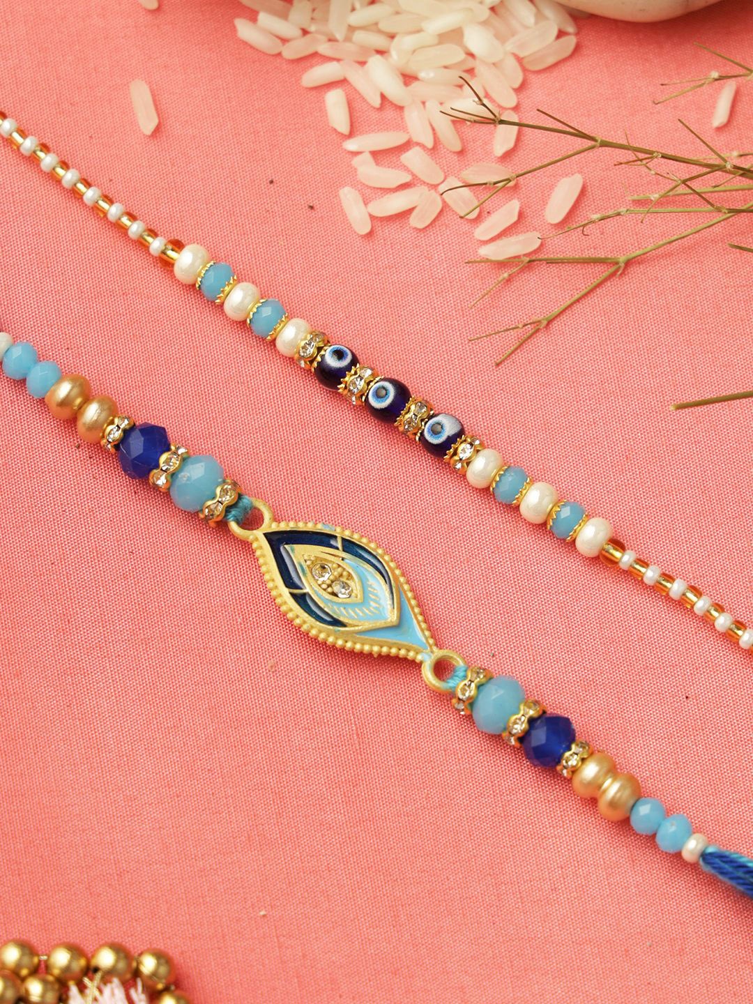 Aapno Rajasthan Set of 2 Evil Eye Beaded Rakhi with Roli Chawal & Greeting Card, Blue
Aapno Rajasthan Set of 2 Evil Eye Beaded Rakhi with Roli Chawal & Greeting Card, Blue