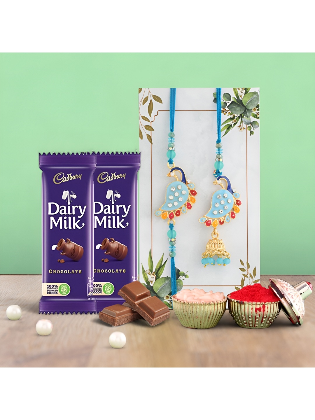 Ascension Set of 2 Rakhi With Dairy Milk Chocolates & Greeting Card With Roli Chawal, Blue
Ascension Set of 2 Rakhi With Dairy Milk Chocolates & Greeting Card With Roli Chawal, Blue