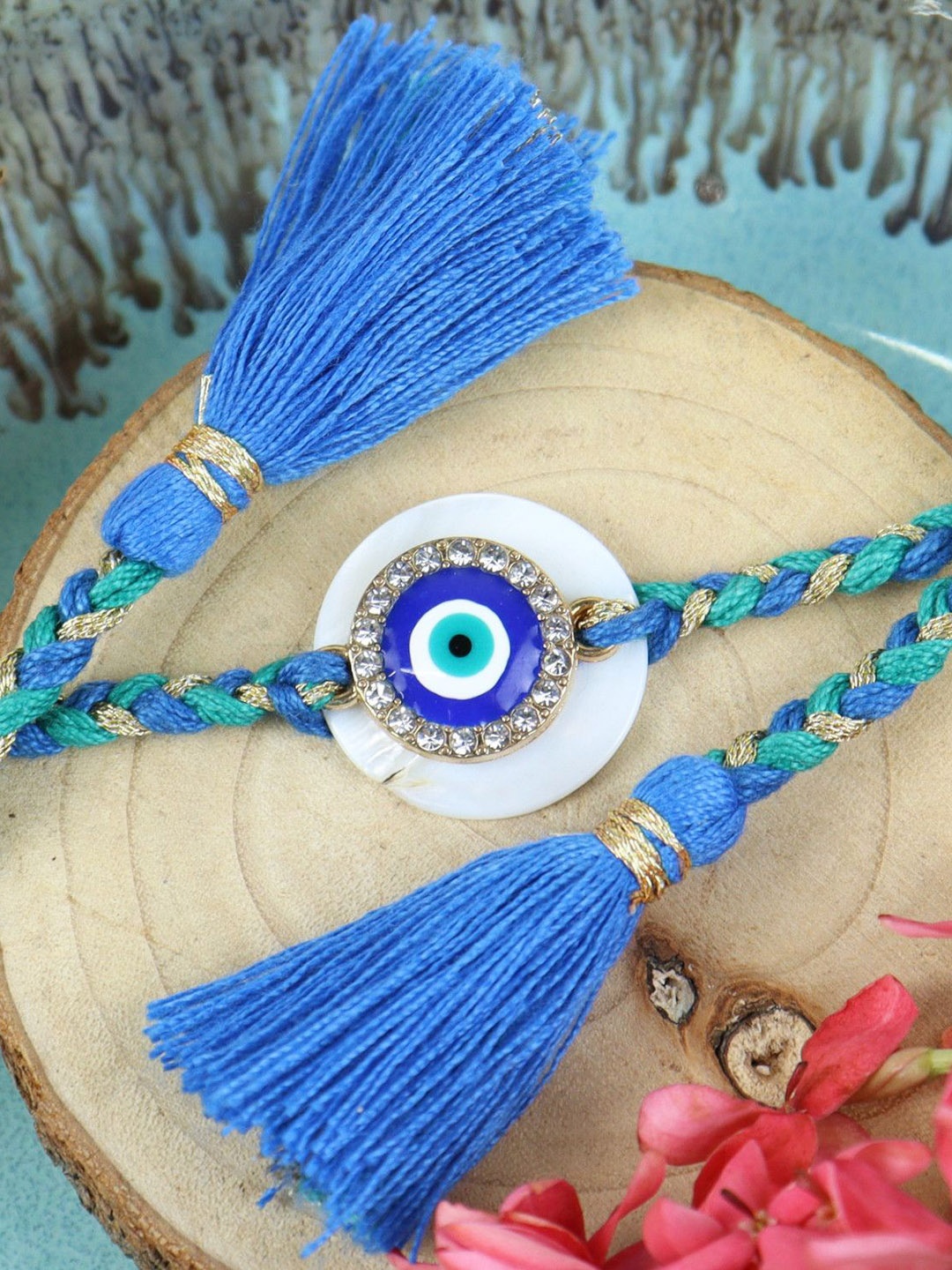 Asthetika Evil Eye Stone Studded Braided Tassel Rakhi With Greeting Card & Roli Chawal, Blue
Asthetika Evil Eye Stone Studded Braided Tassel Rakhi With Greeting Card & Roli Chawal, Blue