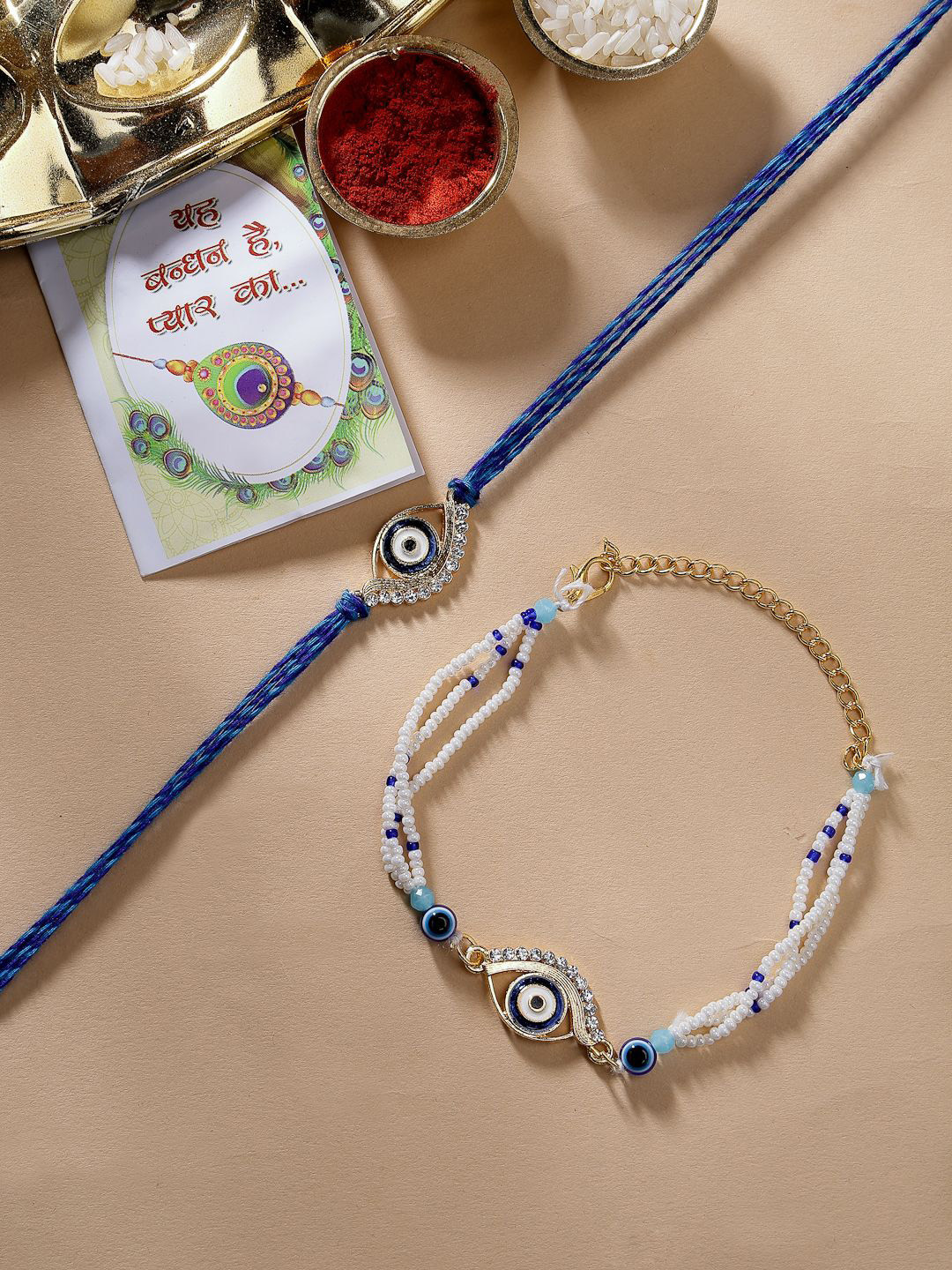 NVR Set of 2 Evil Eye Rakhis With Chocolate & Greeting Card with Roli Chawal, Blue
NVR Set of 2 Evil Eye Rakhis With Chocolate & Greeting Card with Roli Chawal, Blue