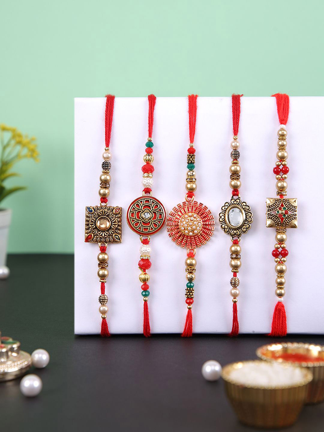 Aapno Rajasthan Set of 5 Beaded Thread Rakhis with Roli Chawal & Greetings Card, Gold
Aapno Rajasthan Set of 5 Beaded Thread Rakhis with Roli Chawal & Greetings Card, Gold