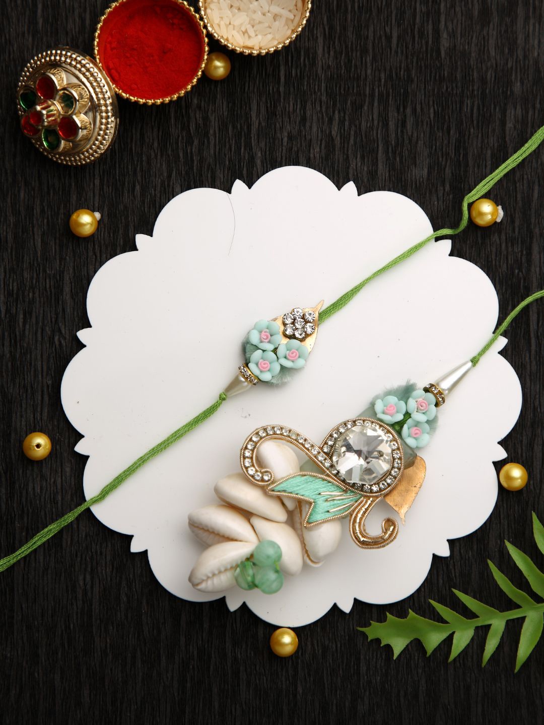 Aapno Rajasthan Floral Bhaiya Bhabhi Thread Rakhi With Roli Chawal & Greetings Card, Green
Aapno Rajasthan Floral Bhaiya Bhabhi Thread Rakhi With Roli Chawal & Greetings Card, Green