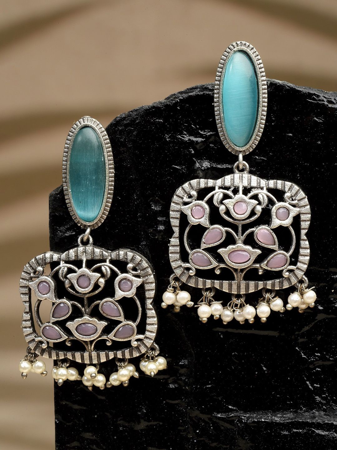 Sanjog Silver-Plated German Silver Contemporary Artificial Stones and Beads Drop Earrings
Sanjog Silver-Plated German Silver Contemporary Artificial Stones and Beads Drop Earrings