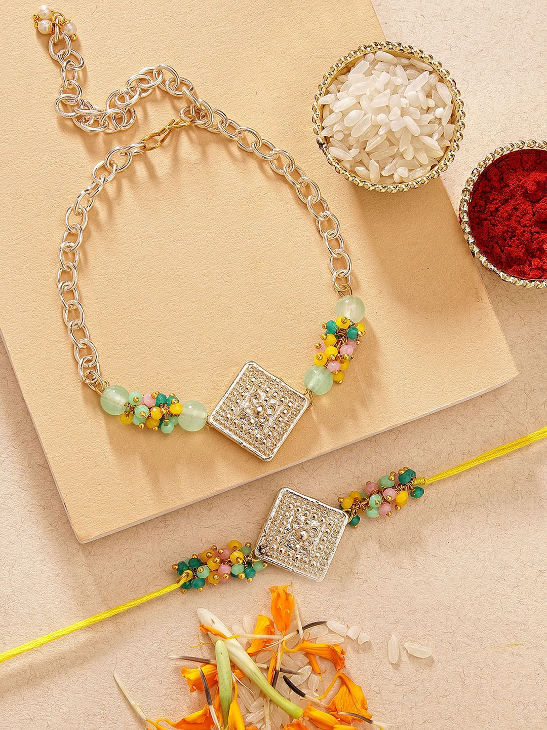 KARATCART Multicolor Crystal Gold Square Kundan Bhaiya Bhabhi Rakhi with Roli & Chawal, Yellow
KARATCART Multicolor Crystal Gold Square Kundan Bhaiya Bhabhi Rakhi with Roli & Chawal, Yellow