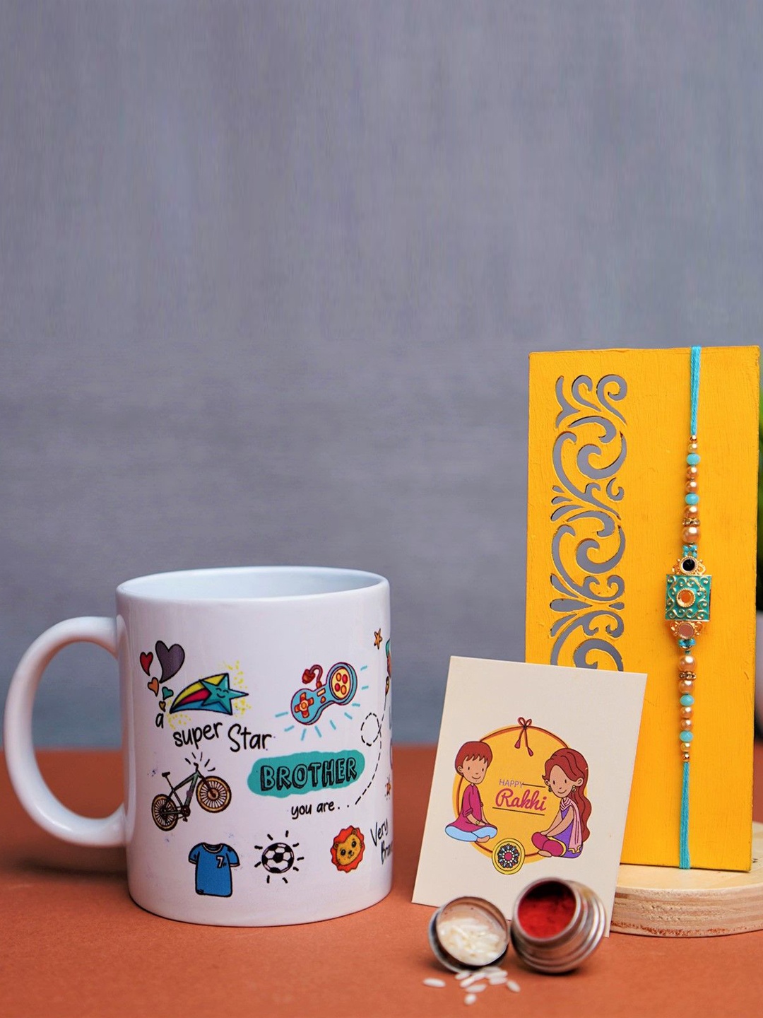 Phirki Studio Set Of 2 Beaded Rakhi With Mug, Greeting Card & Roli Chawal, White
Phirki Studio Set Of 2 Beaded Rakhi With Mug, Greeting Card & Roli Chawal, White
