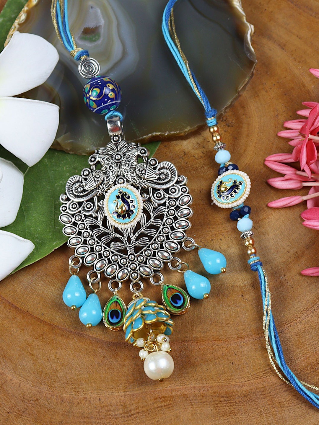 Asthetika Oxidized Pendant With Kundan Stone Bhaiya Bhabhi Rakhis with Roli Chawal, Blue
Asthetika Oxidized Pendant With Kundan Stone Bhaiya Bhabhi Rakhis with Roli Chawal, Blue