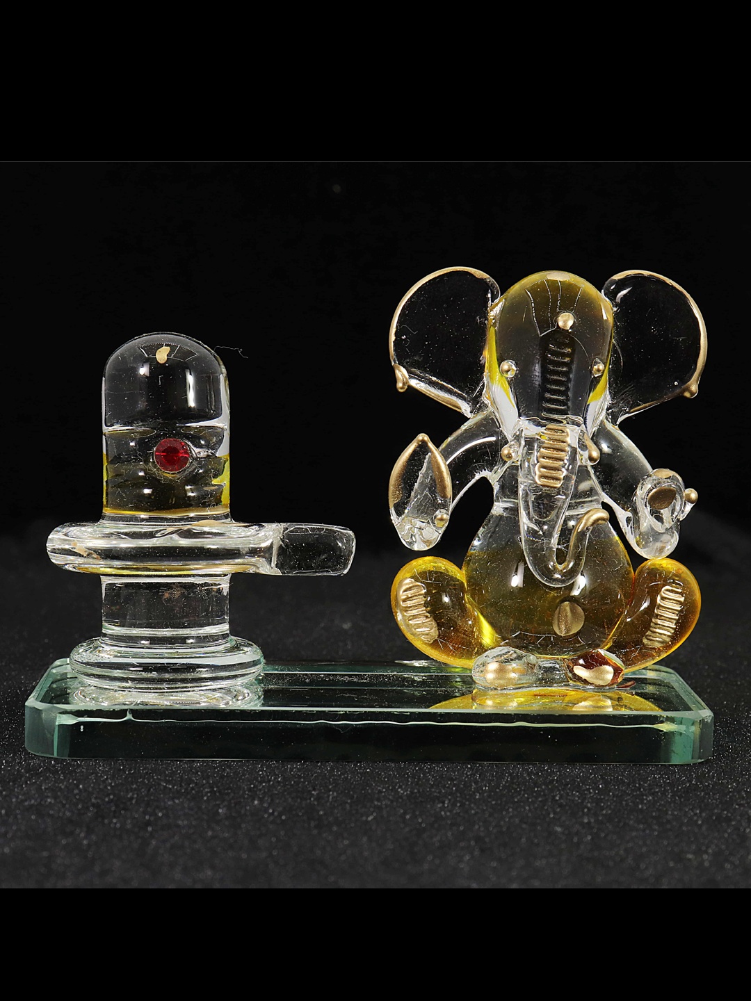 NMII Gold-Toned & Transparent Glass Religious Idol Lord Ganesh Ji with Shivling Showpiece
NMII Gold-Toned & Transparent Glass Religious Idol Lord Ganesh Ji with Shivling Showpiece