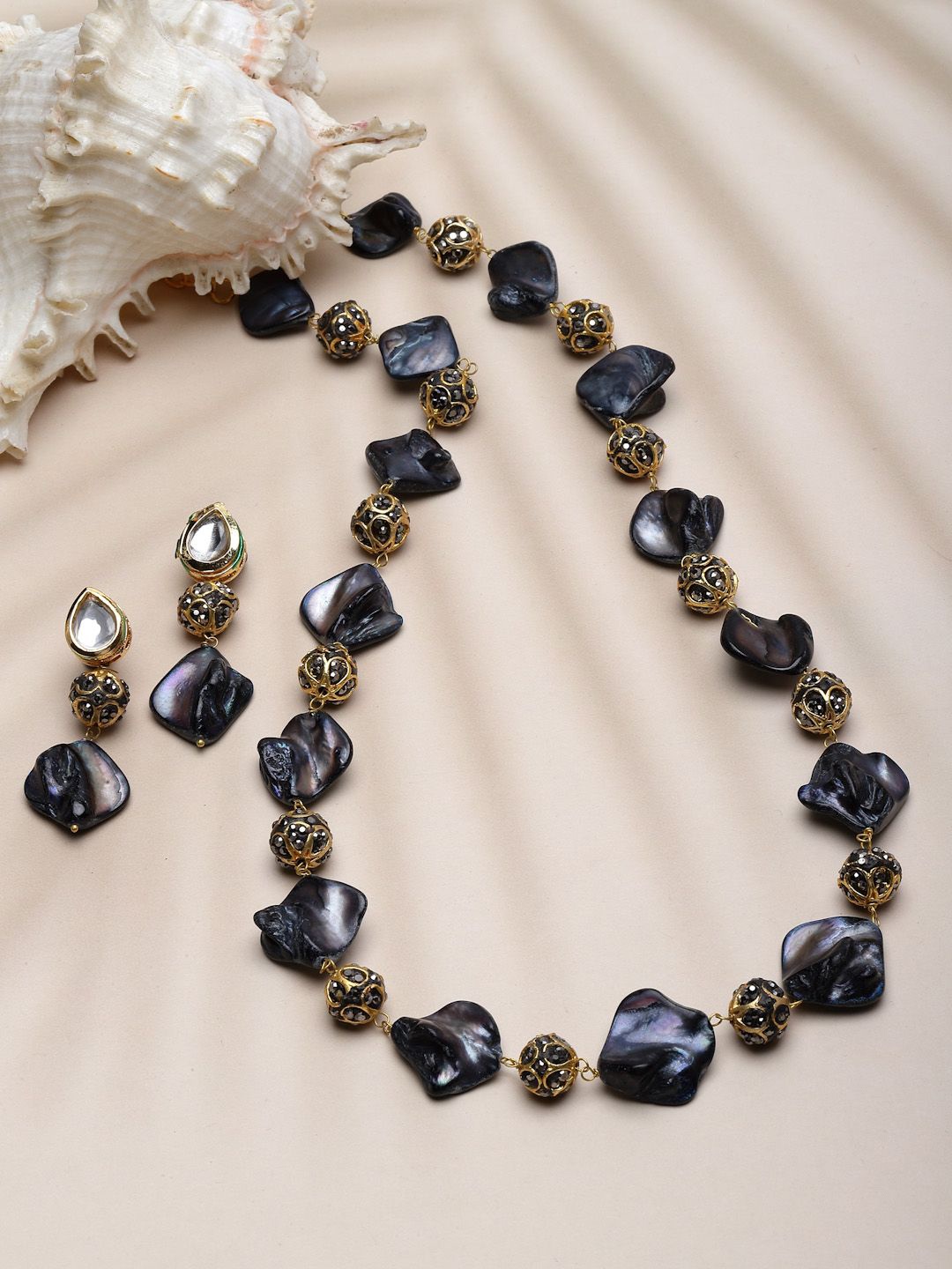 Sanjog Mother Of Pearl Black & Grey Stone Studded Long Kundan Jaipur Jewellery Set, Gold
Sanjog Mother Of Pearl Black & Grey Stone Studded Long Kundan Jaipur Jewellery Set, Gold