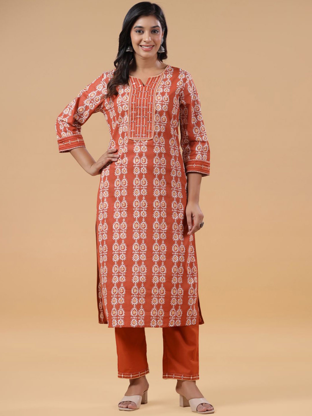 SAVI Ethnic Motifs Printed Regular Mirror Work Pure Cotton Kurta with Trousers, Rust
SAVI Ethnic Motifs Printed Regular Mirror Work Pure Cotton Kurta with Trousers, Rust