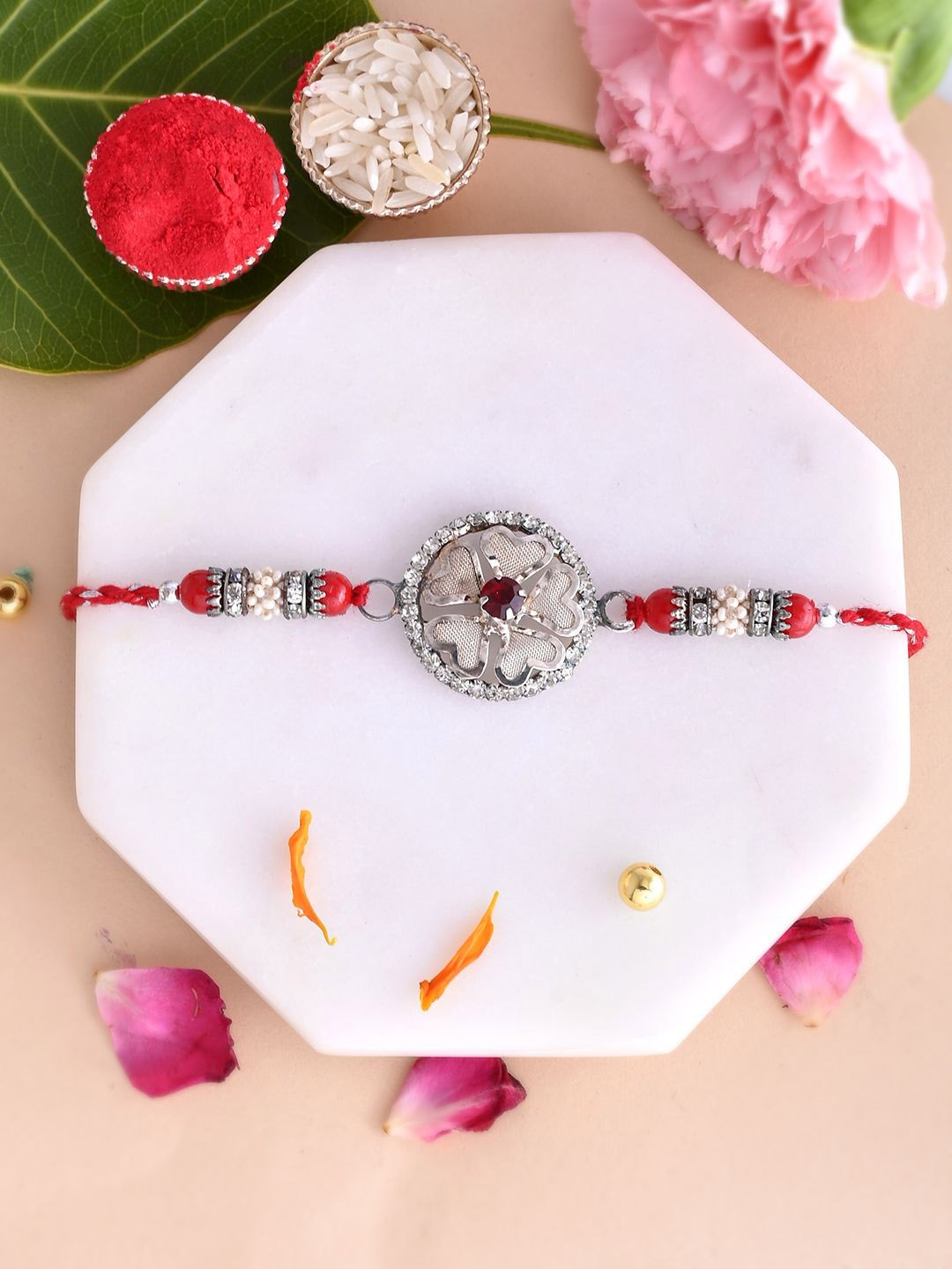 Aapno Rajasthan AD Studded Heart Shape Floral Rakhi With Roli Chawal & Greetings Card, Red
Aapno Rajasthan AD Studded Heart Shape Floral Rakhi With Roli Chawal & Greetings Card, Red