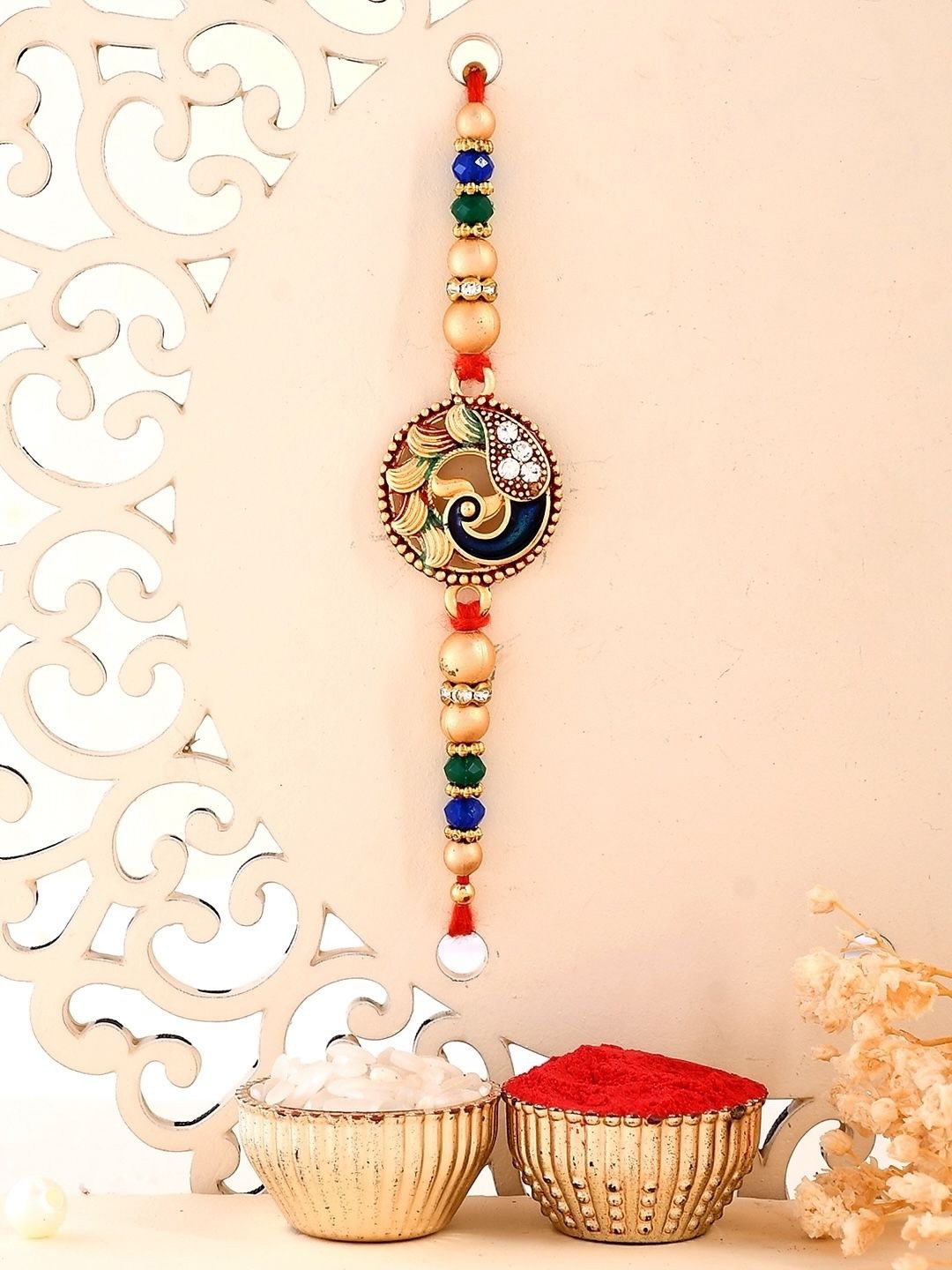 Aapno Rajasthan Peacock Design Stone Studded & Beaded Thread Rakhi With Roli Chawal, Gold
Aapno Rajasthan Peacock Design Stone Studded & Beaded Thread Rakhi With Roli Chawal, Gold
