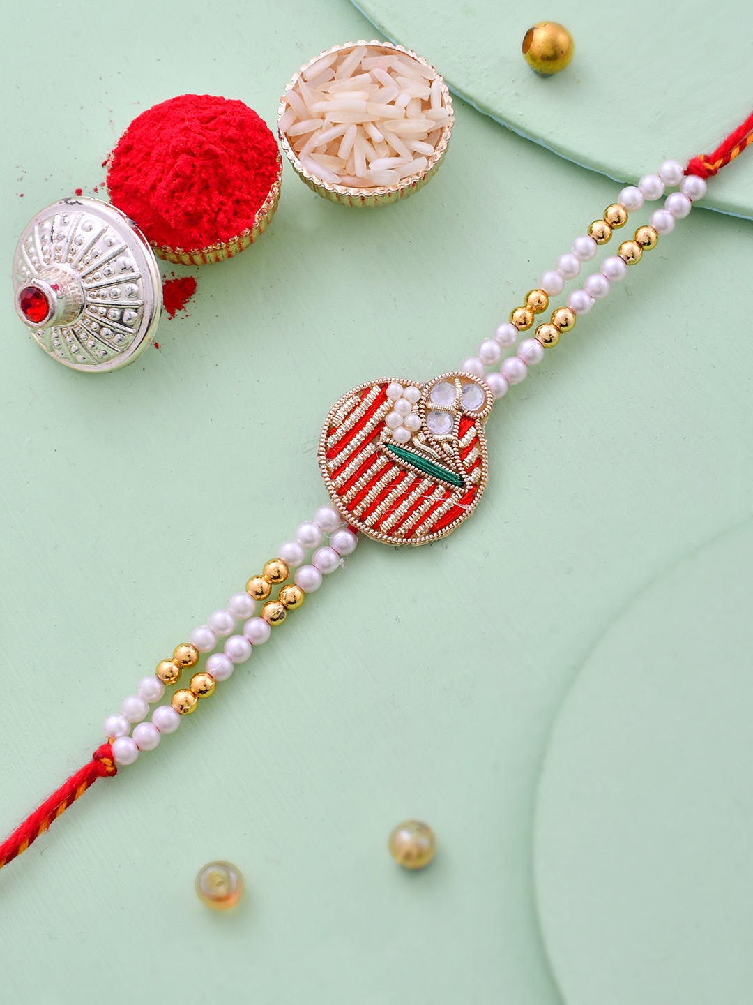 House of Pataudi Kundan-Studded & Pearl Beaded Rakhi With Roli Rice & Greeting Card, Red
House of Pataudi Kundan-Studded & Pearl Beaded Rakhi With Roli Rice & Greeting Card, Red