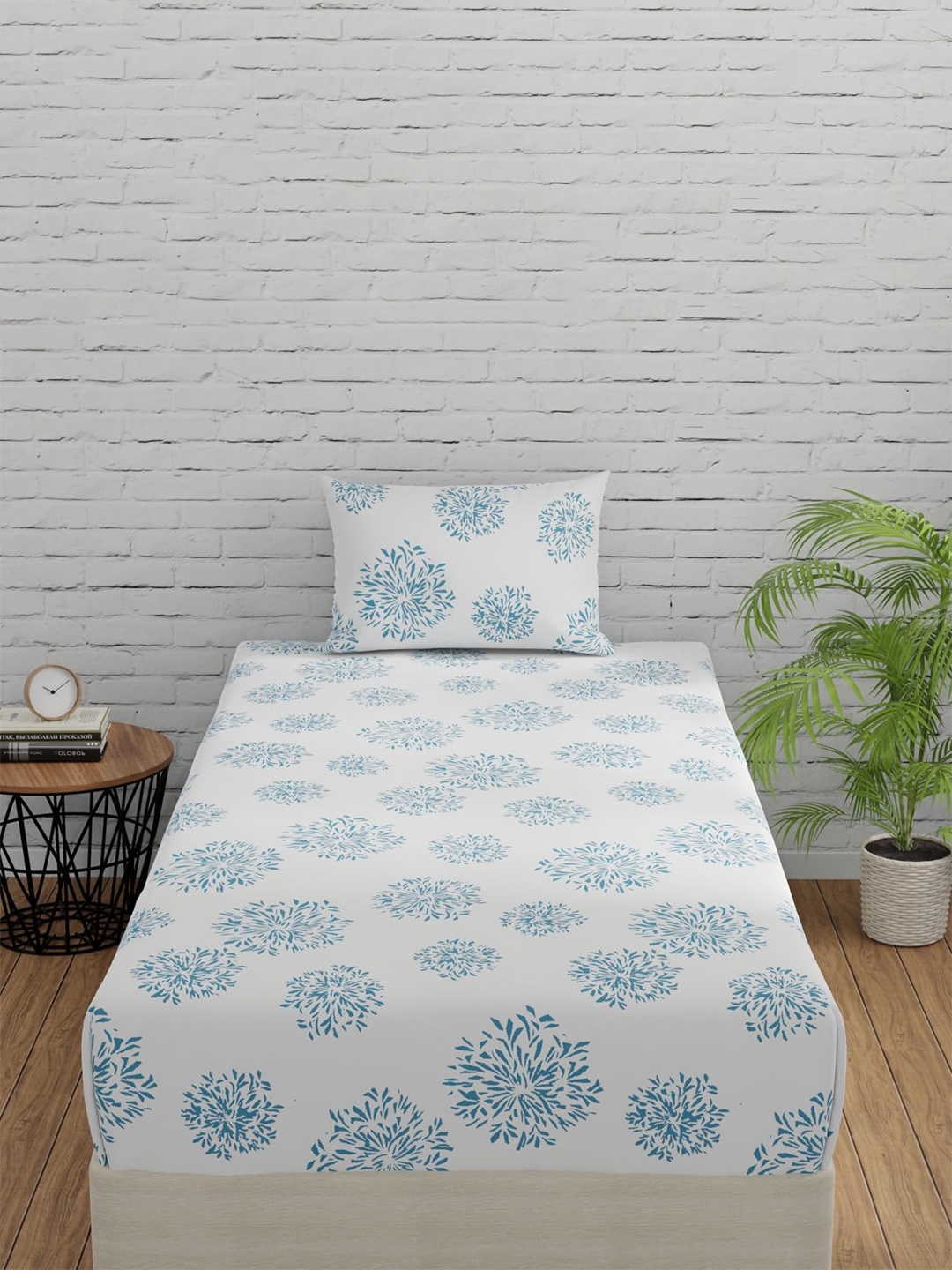 Huesland White & Blue Floral Fitted Cotton 144 TC Single Bedsheet With 1 Pillow Cover
Huesland White & Blue Floral Fitted Cotton 144 TC Single Bedsheet With 1 Pillow Cover