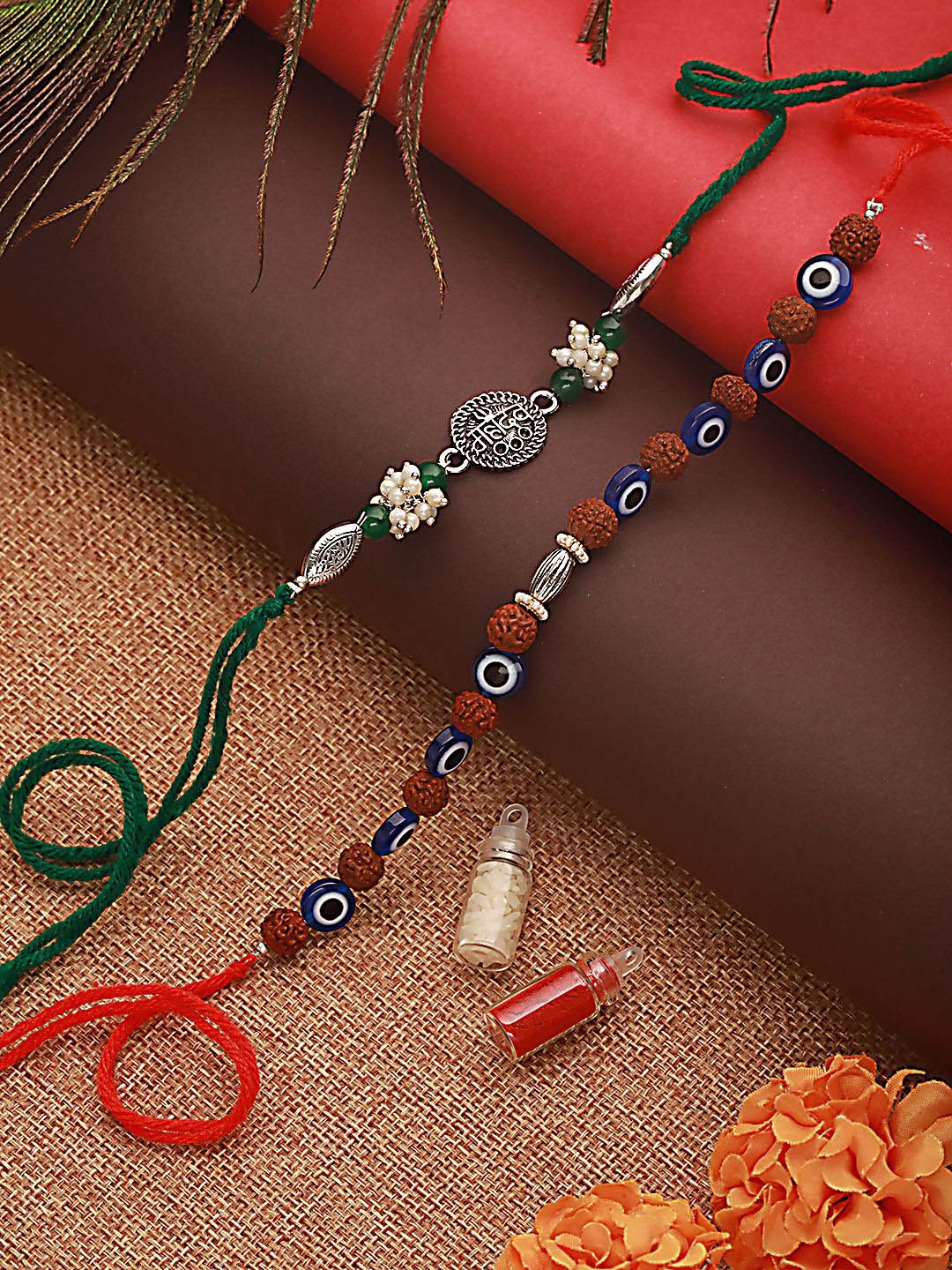 Jazz and Sizzle Set of 2 Rudraksh Evil Eye & Mahadev Rakhis With Roli & Chawal, Silver
Jazz and Sizzle Set of 2 Rudraksh Evil Eye & Mahadev Rakhis With Roli & Chawal, Silver