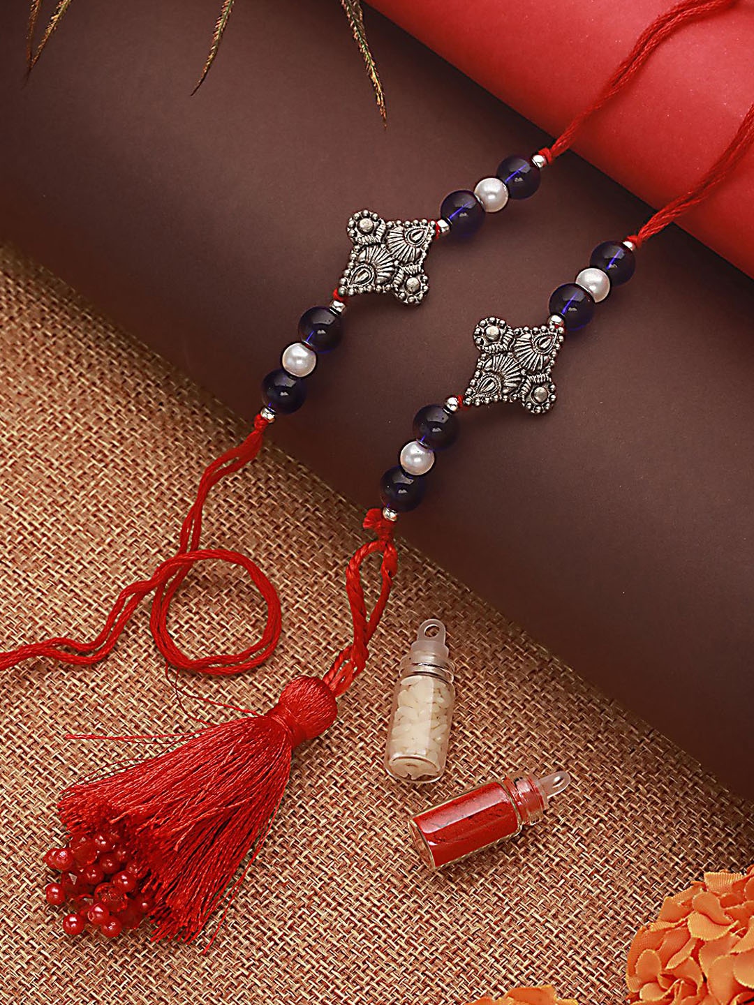 Jazz and Sizzle Pearl Beaded Bhaiya Bhabhi Tasselled Rakhi With Roli & Chawal, Blue
Jazz and Sizzle Pearl Beaded Bhaiya Bhabhi Tasselled Rakhi With Roli & Chawal, Blue