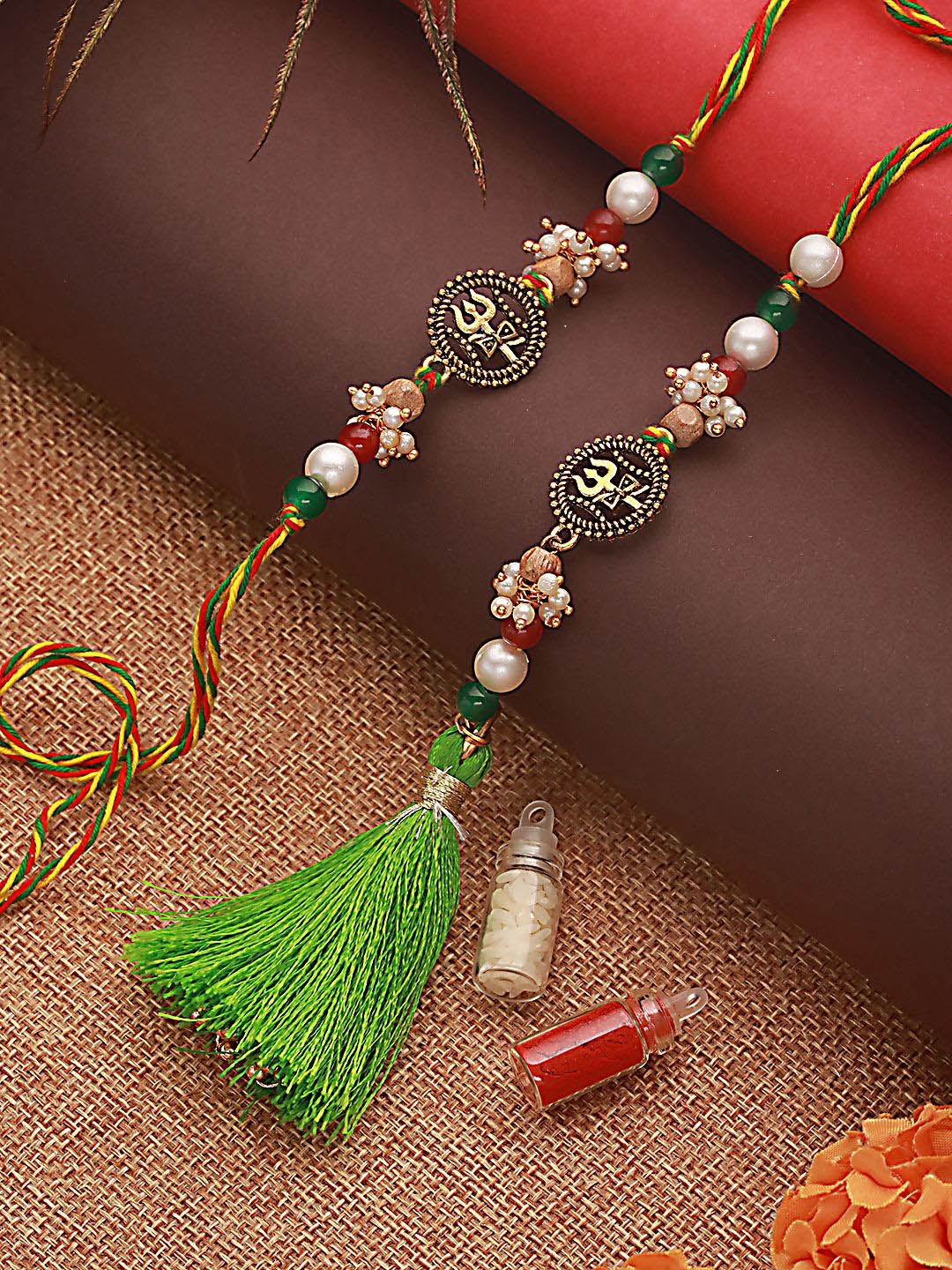 Jazz and Sizzle Trishul & Pearl Beaded Bhaiya Bhabhi Tasselled Rakhi With Roli & Chawal, Gold
Jazz and Sizzle Trishul & Pearl Beaded Bhaiya Bhabhi Tasselled Rakhi With Roli & Chawal, Gold