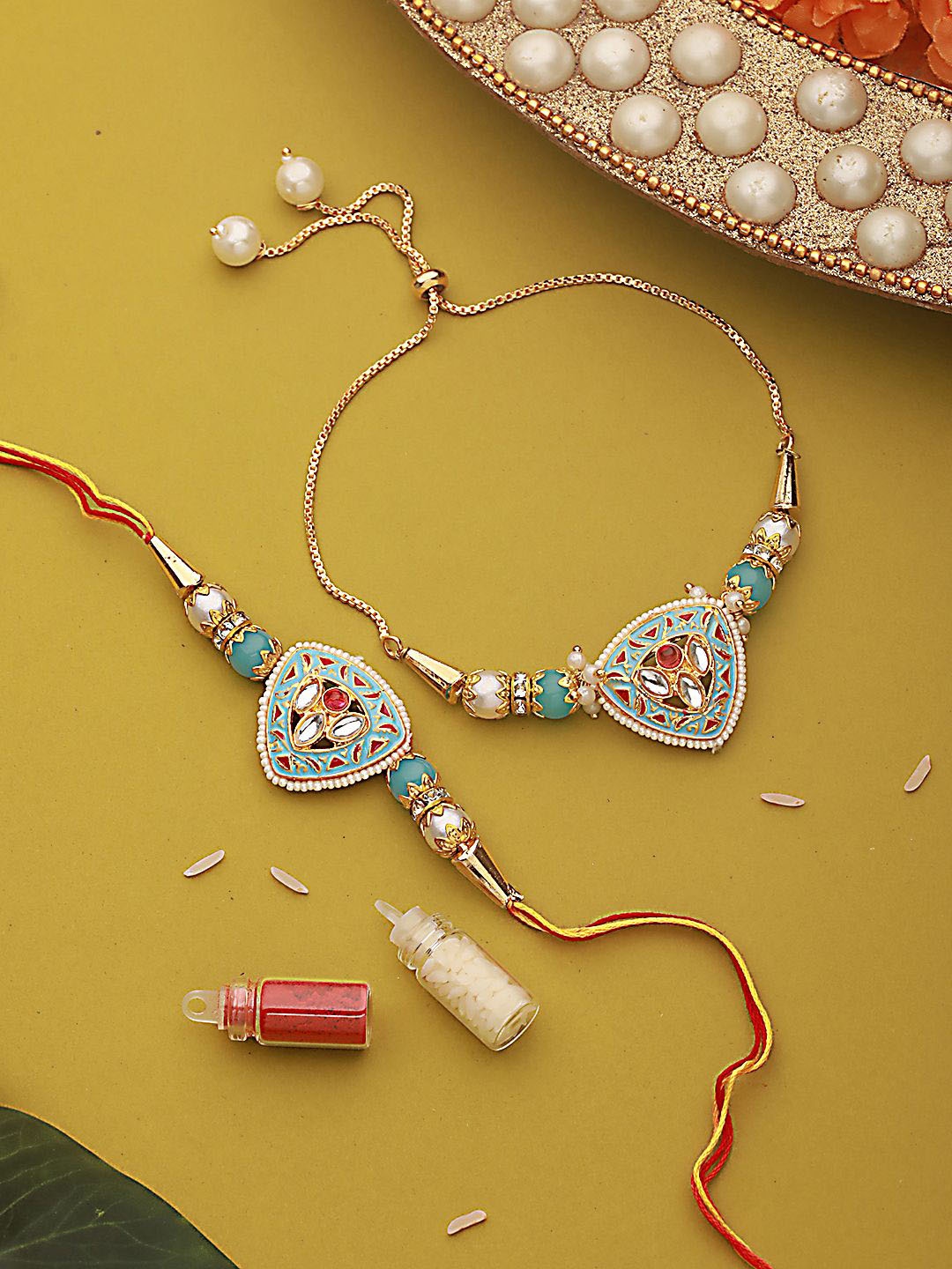 Jazz and Sizzle Kundan Studded & Pearl Beaded Meenakari Bhaiya Bhabhi Chain Rakhi with Roli & Chawal, Blue
Jazz and Sizzle Kundan Studded & Pearl Beaded Meenakari Bhaiya Bhabhi Chain Rakhi with Roli & Chawal, Blue