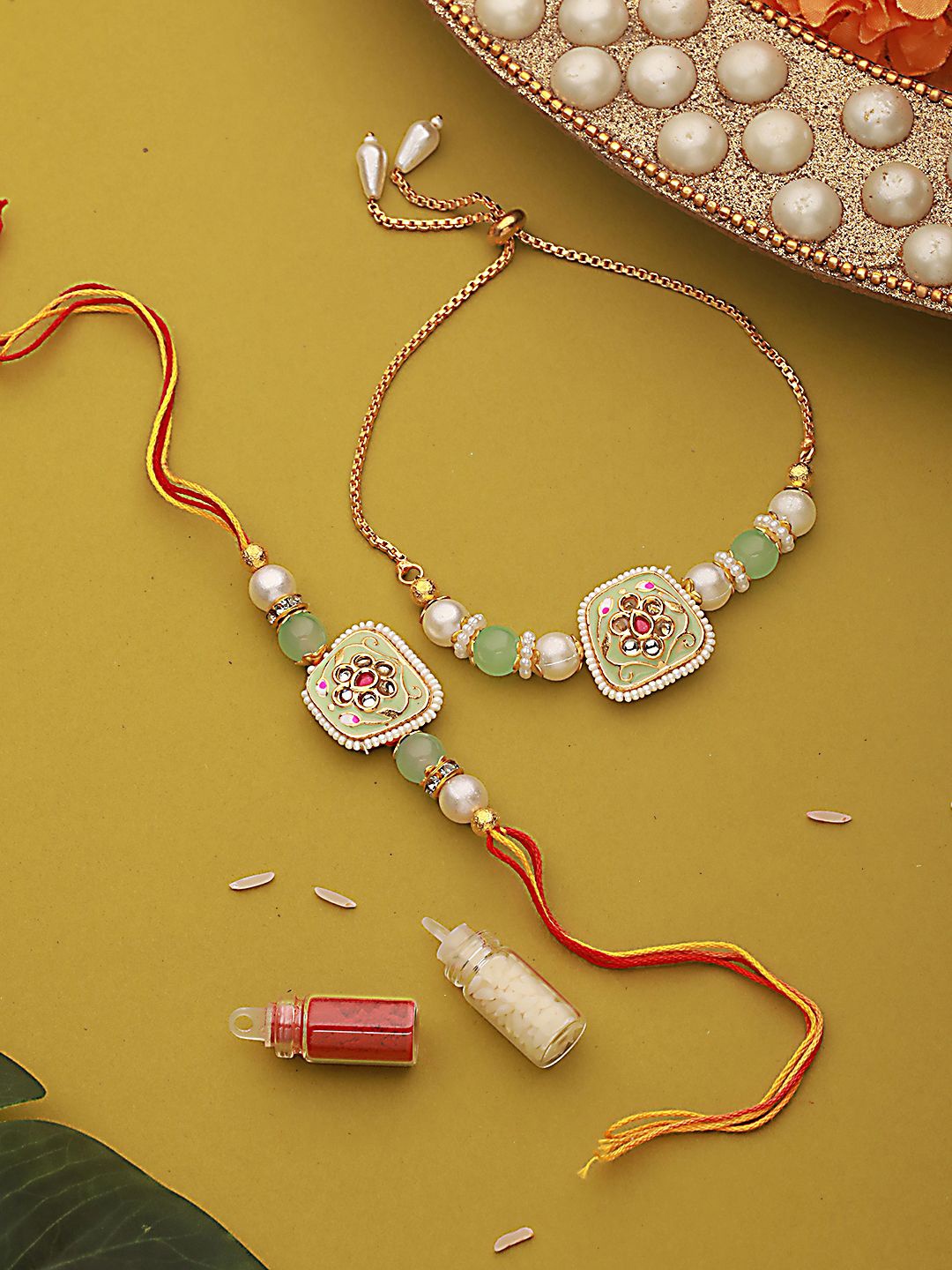 Jazz and Sizzle Kundan Studded & Pearl Beaded Bhaiya Bhabhi Chain Rakhi with Roli & Chawal, Fluorescent green
Jazz and Sizzle Kundan Studded & Pearl Beaded Bhaiya Bhabhi Chain Rakhi with Roli & Chawal, Fluorescent green