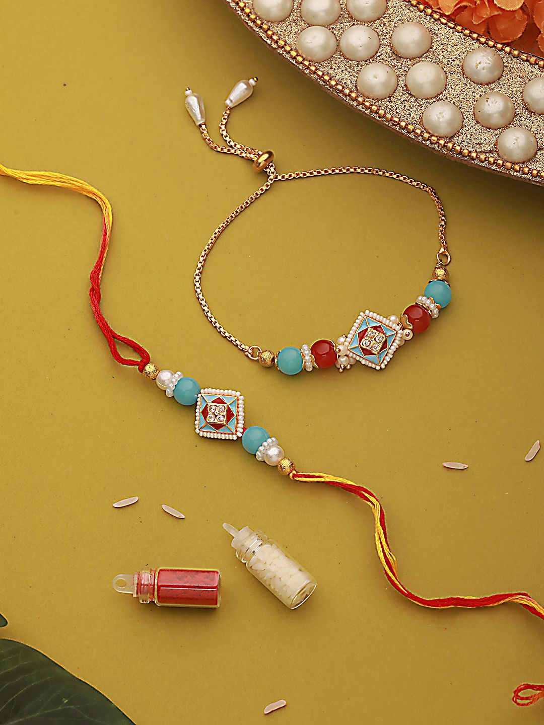 Jazz and Sizzle Kundan Studded & Pearl Beaded Meenakari Bhaiya Bhabhi Chain Rakhi with Roli & Chawal, Blue
Jazz and Sizzle Kundan Studded & Pearl Beaded Meenakari Bhaiya Bhabhi Chain Rakhi with Roli & Chawal, Blue