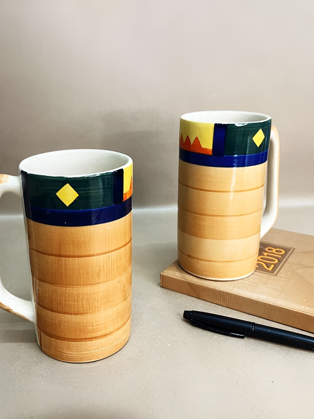 The Artisan Emporium Brown & Navy Blue 2 Pieces Printed Glossy Ceramic Mugs 350 ml Each
The Artisan Emporium Brown & Navy Blue 2 Pieces Printed Glossy Ceramic Mugs 350 ml Each