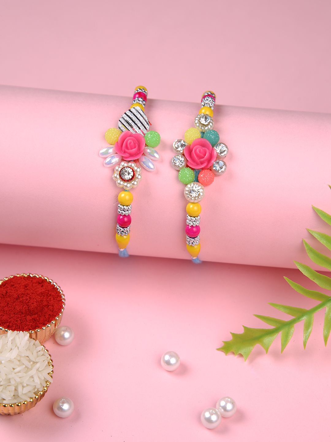 Aapno Rajasthan Set Of 2 Floral Beaded Thread Rakhi With Roli Chawal & Greeting Card, Pink
Aapno Rajasthan Set Of 2 Floral Beaded Thread Rakhi With Roli Chawal & Greeting Card, Pink