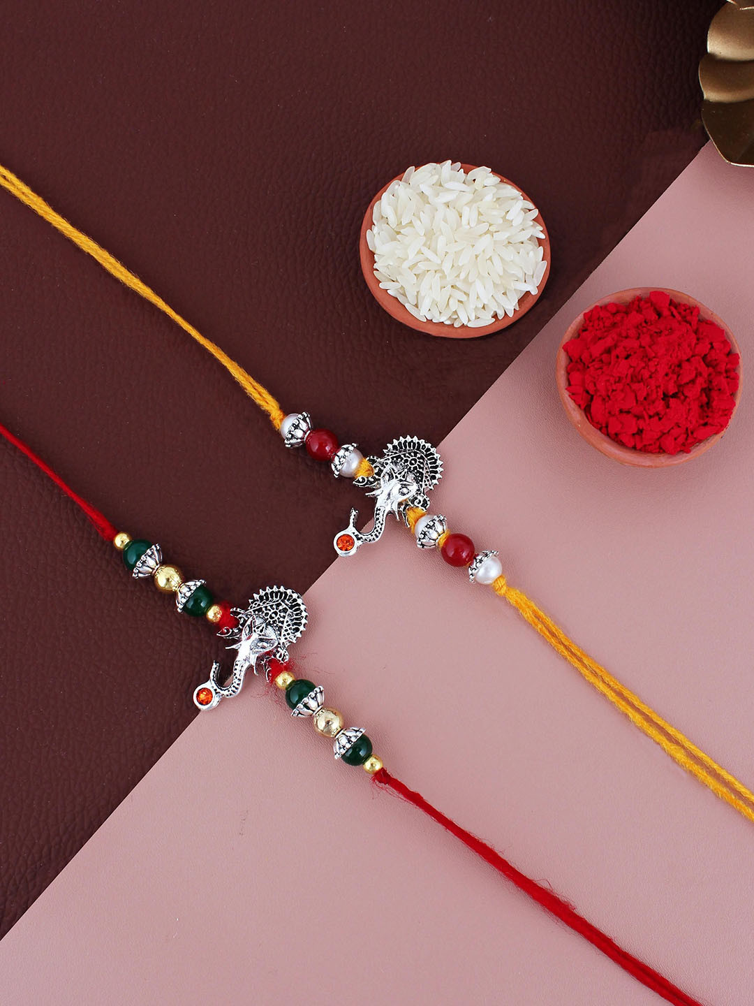 LUCKY JEWELLERY Set Of 2 Beaded German Silver Rakhis with Roli Chawal & Greeting Card
LUCKY JEWELLERY Set Of 2 Beaded German Silver Rakhis with Roli Chawal & Greeting Card