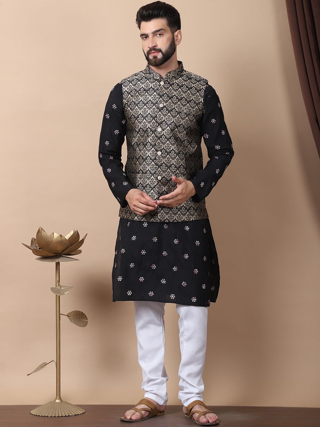 Anouk Black Floral Embroidered Sequinned Cotton Silk Kurta with Churidar & Nehru Jacket
Anouk Black Floral Embroidered Sequinned Cotton Silk Kurta with Churidar & Nehru Jacket
