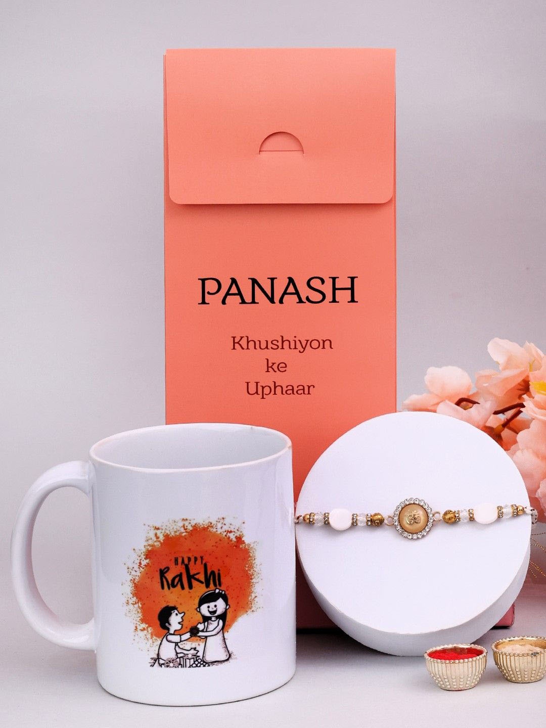 PANASH Set Of 3 Gold-Plated Om Shaped Thread Rakhi With Printed Mug & Roli Chawal, Pink
PANASH Set Of 3 Gold-Plated Om Shaped Thread Rakhi With Printed Mug & Roli Chawal, Pink
