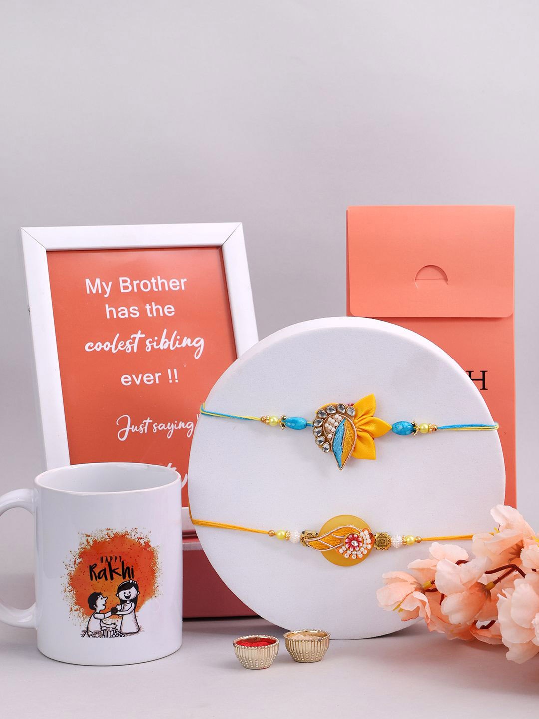 PANASH Set Of 4 Gold-Plated Stone Studded Rakhi With Mug And Photo Frame With Roli Chawal
PANASH Set Of 4 Gold-Plated Stone Studded Rakhi With Mug And Photo Frame With Roli Chawal