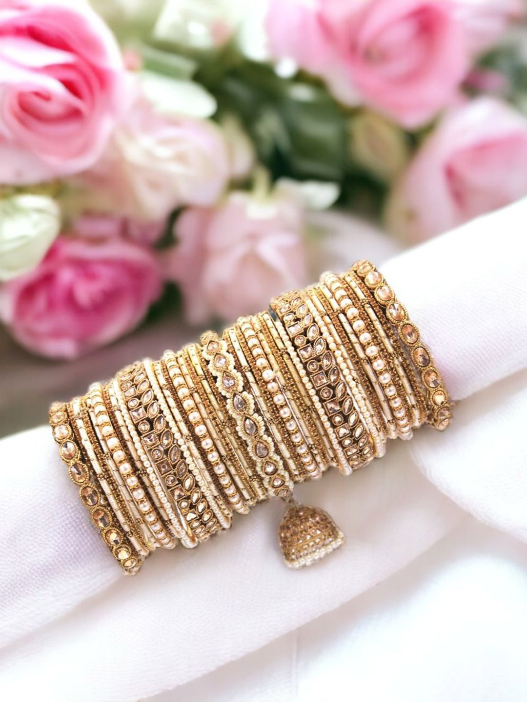 leshya Set Of 37 Brass-Plated Ranisa Single Hand Kundan Jhumki Beaded Bangles, Beige
leshya Set Of 37 Brass-Plated Ranisa Single Hand Kundan Jhumki Beaded Bangles, Beige